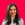 a woman with long hair and a turtle neck sweater