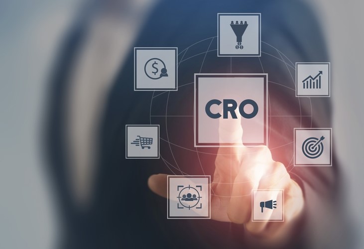 Hand pointing to an icon saying "CRO" with other icons around it
