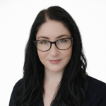 a woman with long black hair wearing glasses