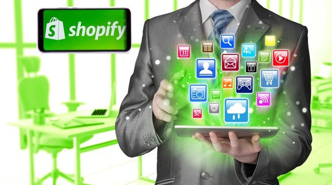 Man holding a tablet with my app icons above the screen