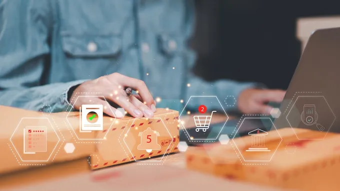 An online seller working on a computer to check their seasonal inventory levels